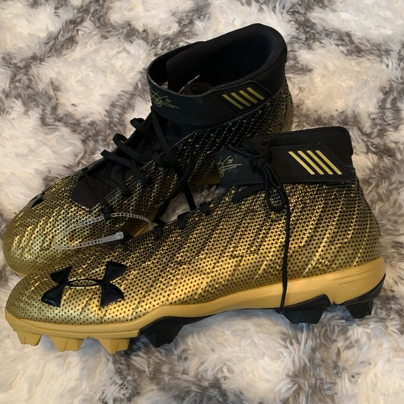 gold and black under armour cleats